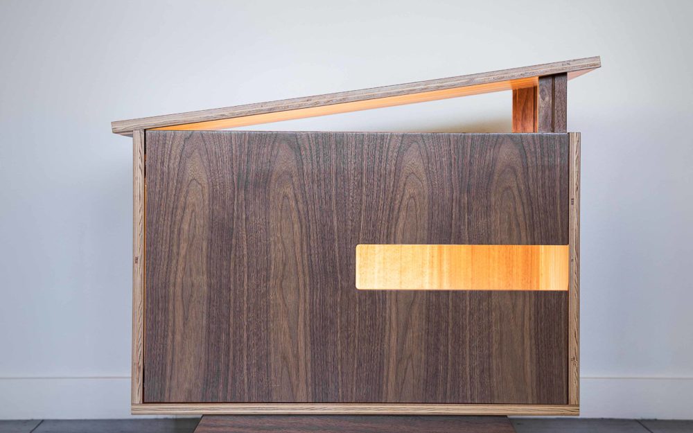 Direct front view of the dog house being lighted.