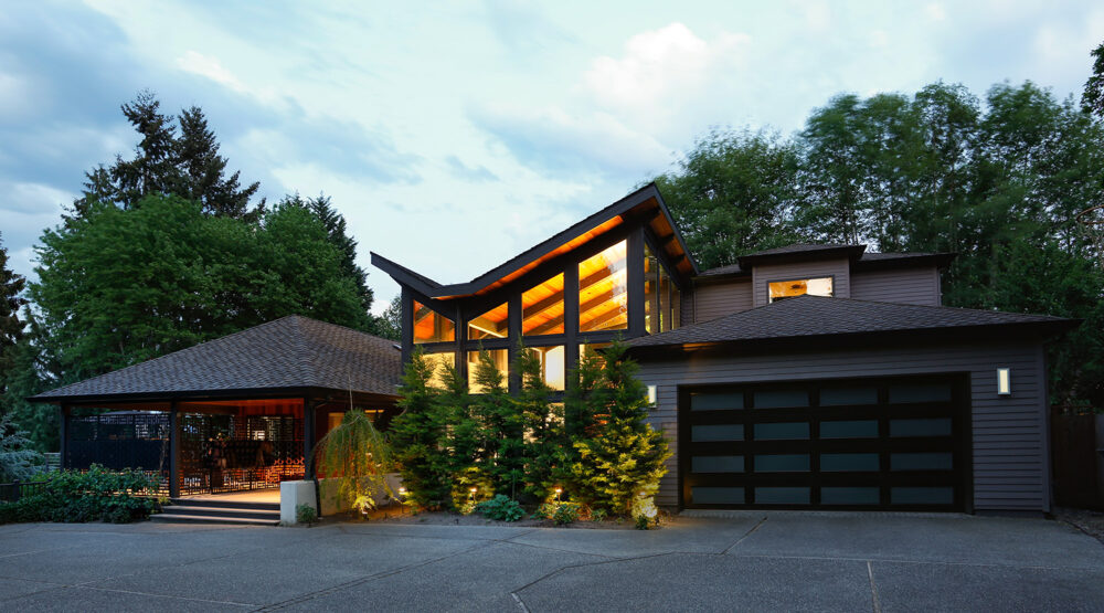 An overview of the house and the addition at night.
