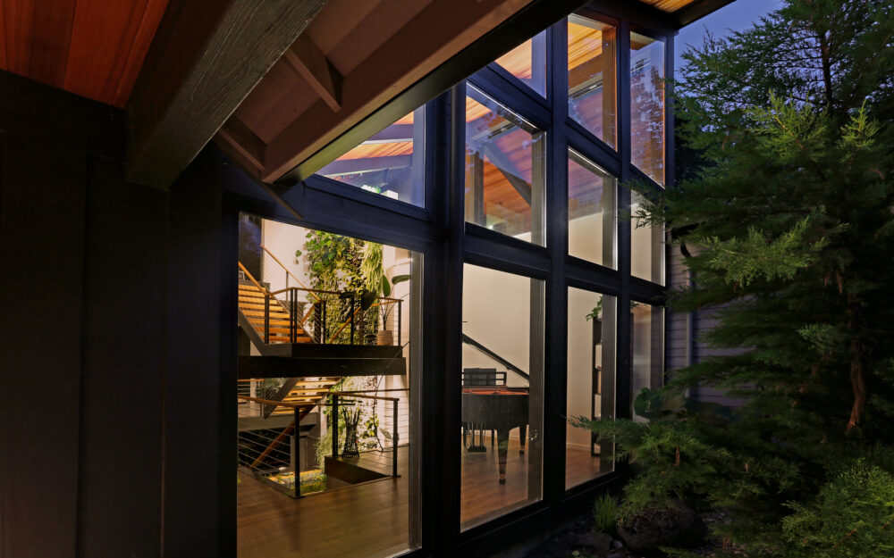 A close up view of the new addition glass wall from the front entry porch.