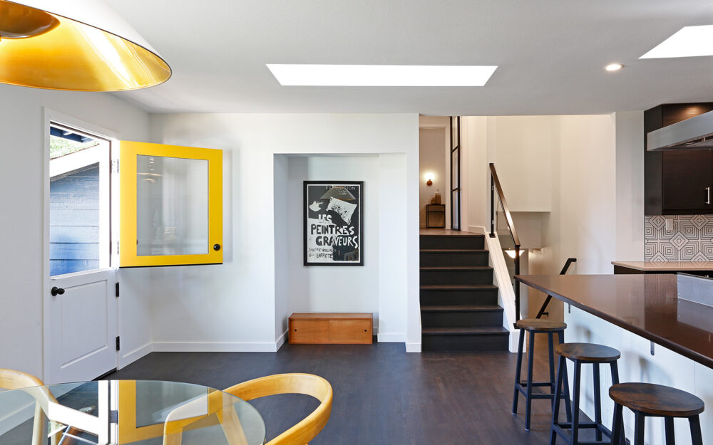 The foyer space with the Dutch door open.
