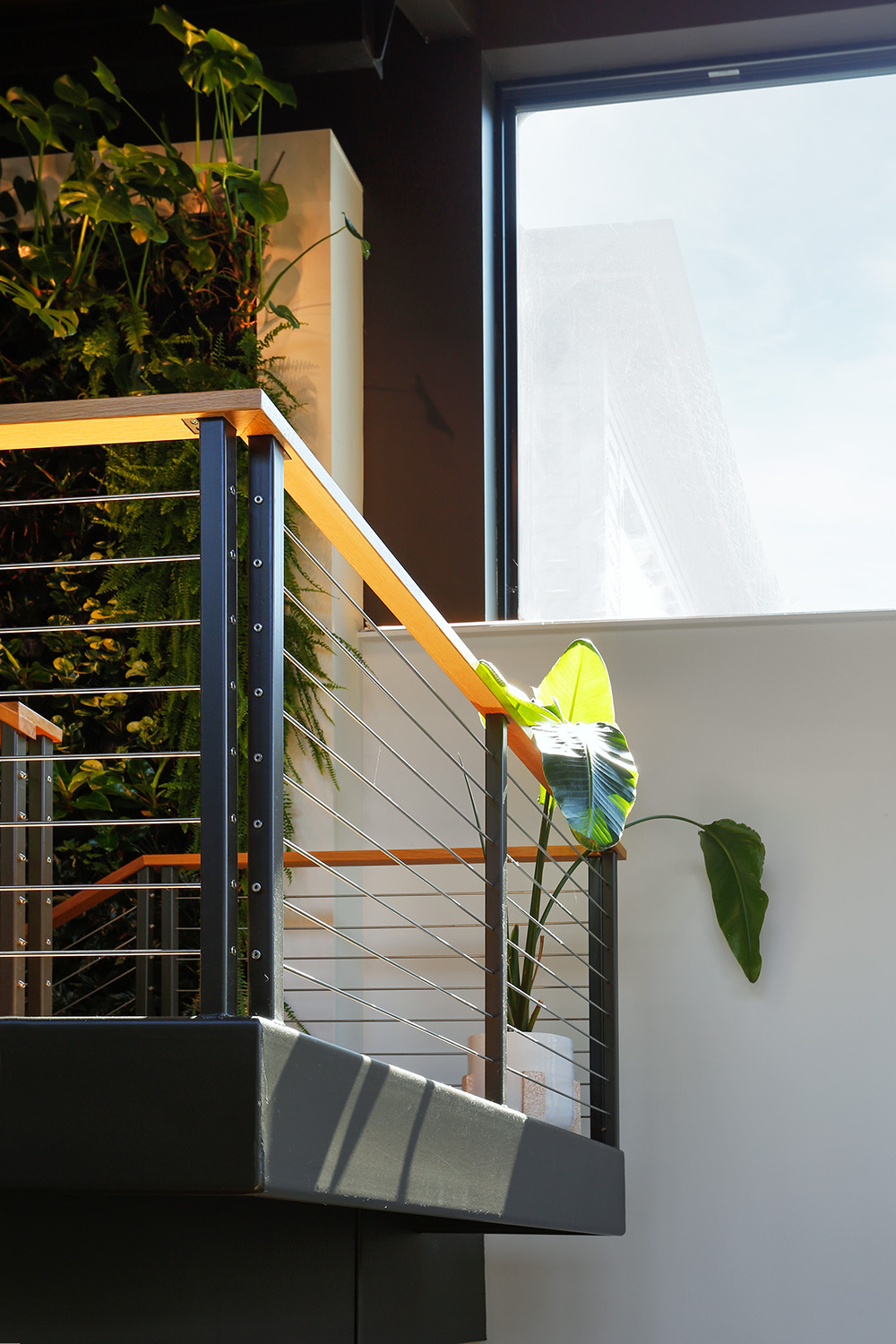 4681B Close up of the stair railings and the green wall.