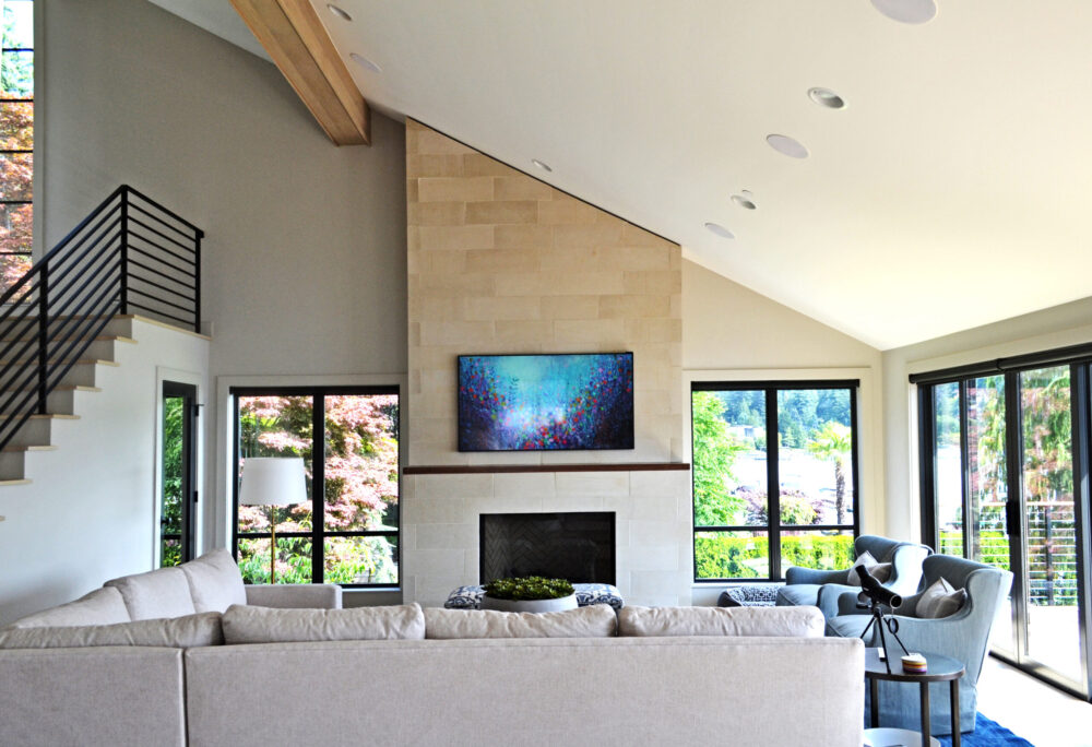The living room with furniture centered around a great fireplace.