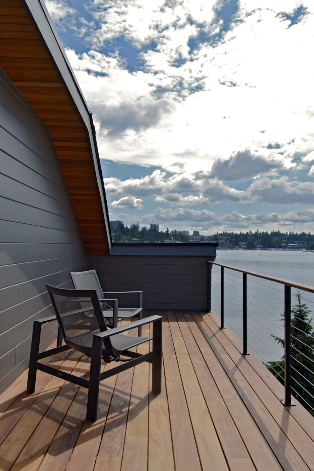 The upper deck of the house with a view toward the water and landscape beyond.