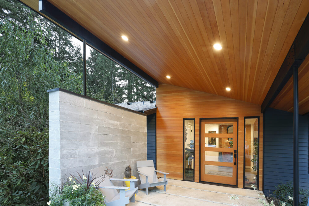 Close up view of the entry porch board formed concrete wall.