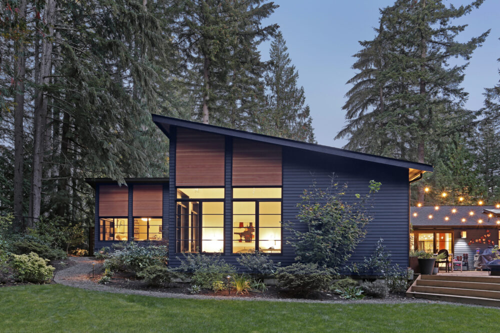 Head-on view of the back of the house at night.