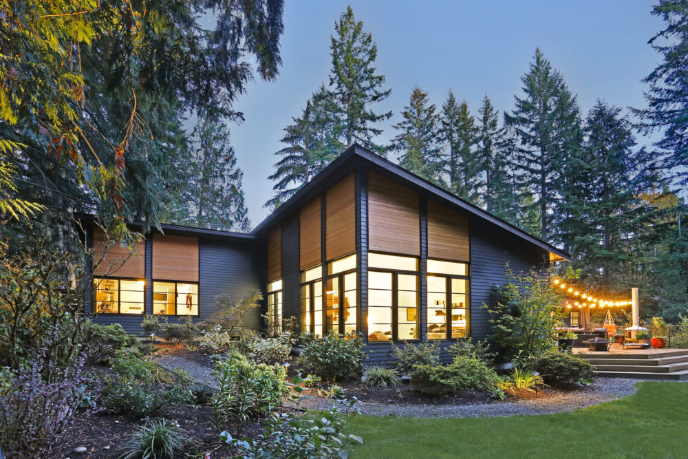 The back of house and deck at night.